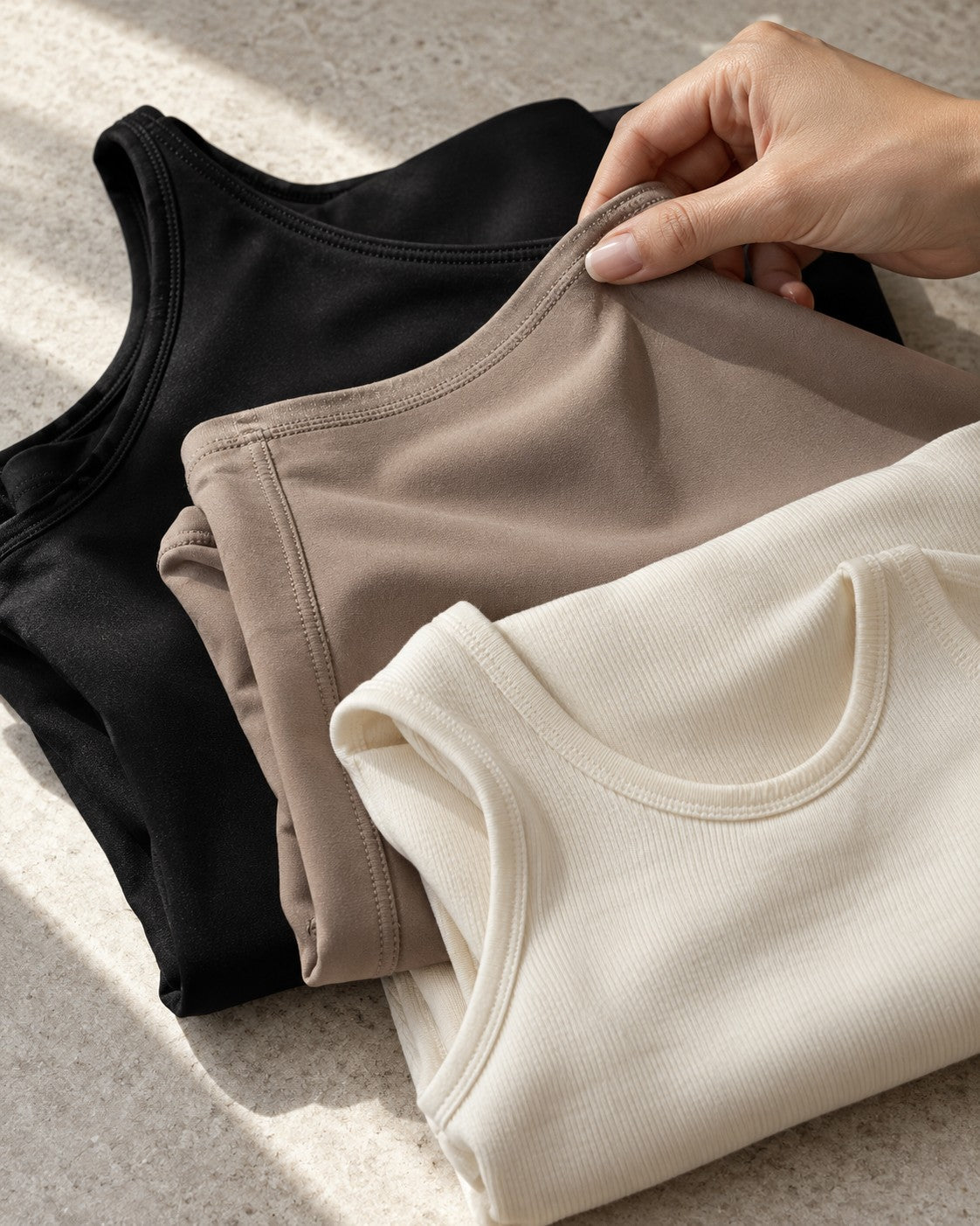 Black, taupe and cream fabric layers in natural light